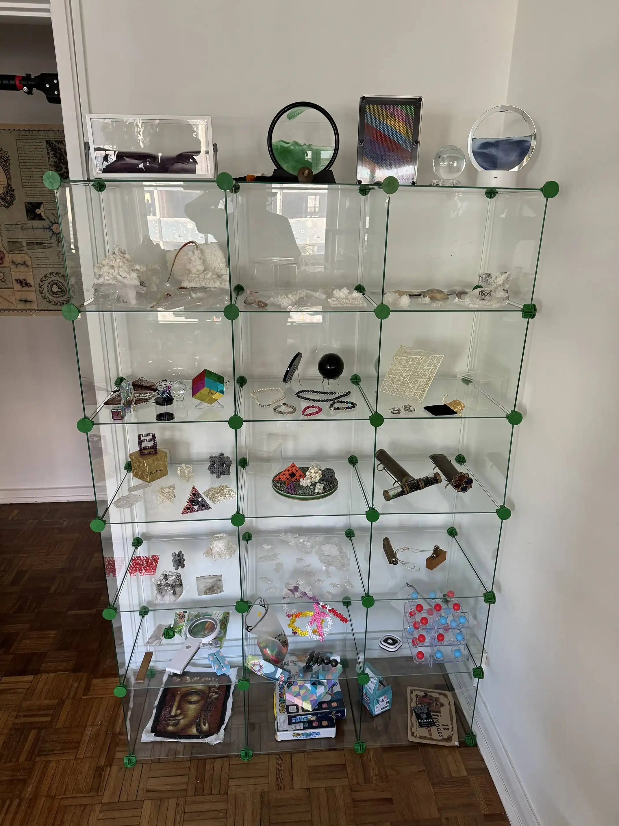 Glass vitrine for showing objects, 24 cubes easily configurable. Big one is Height 170cm Wide 110cm Deep 36cm